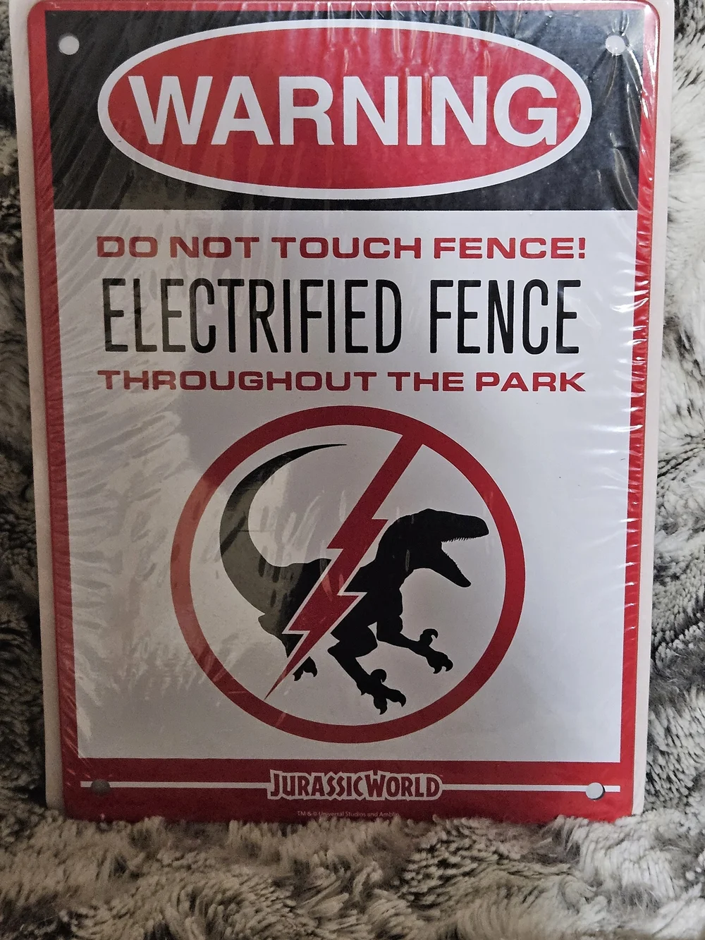 Jurassic World Loot Cate Metal Sign